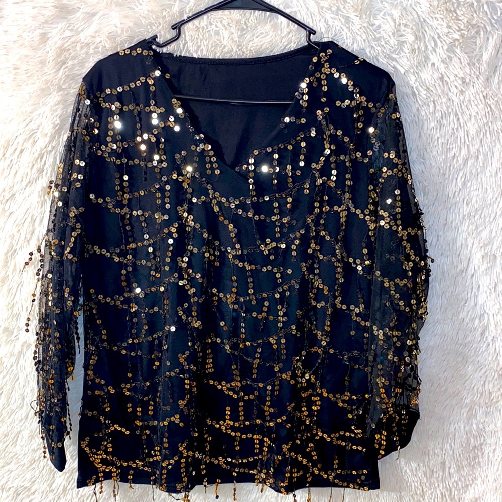 Never worn sequin black long sleeve top